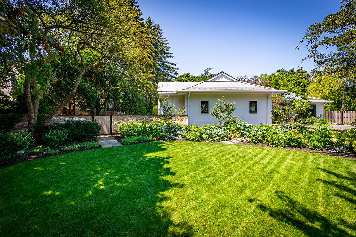 large lawn with surrounding beds