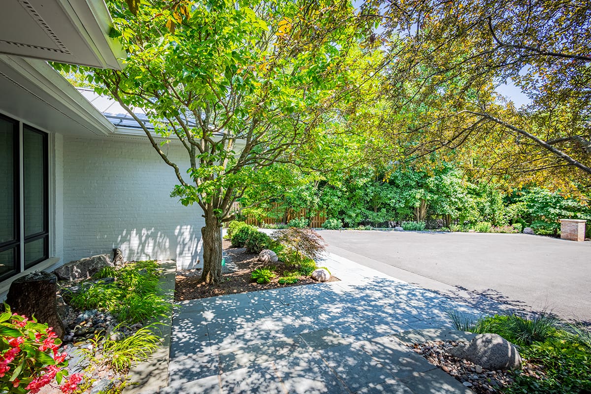 modern front entrance with paver walkway