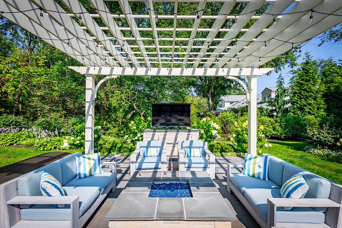 pergola with firepit and tv
