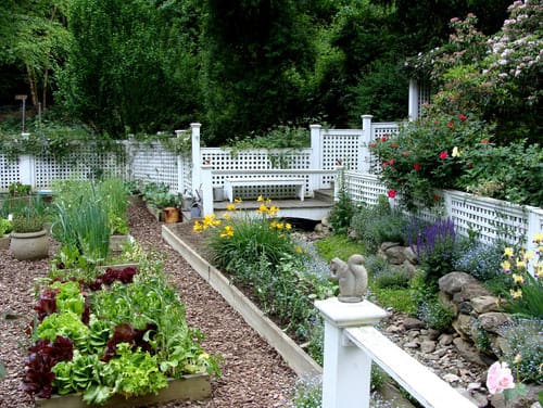 vegetable garden with custom white fencing