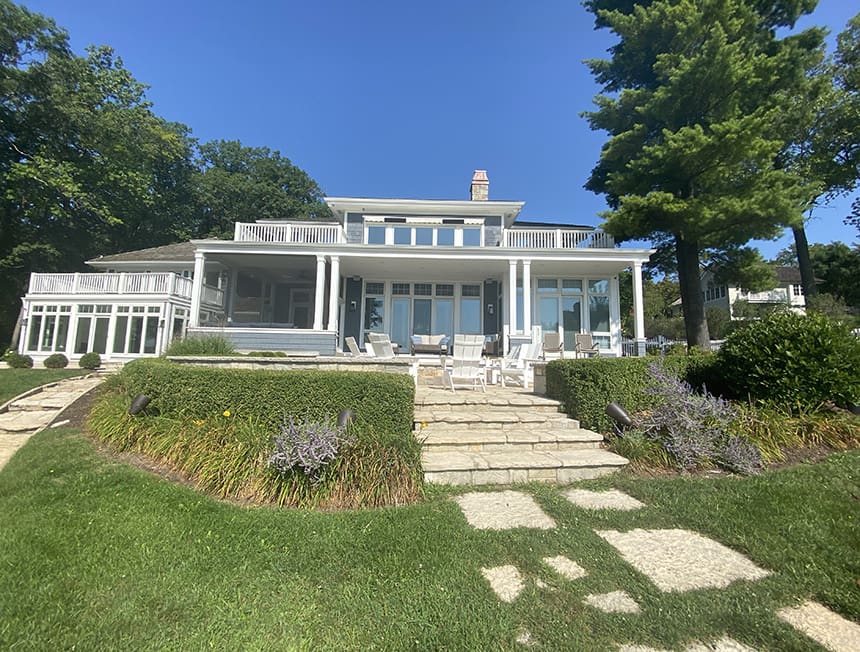 Before renovation view of a lakeside property in Williams Bay, Wisconsin, prior to pool and terrace construction.